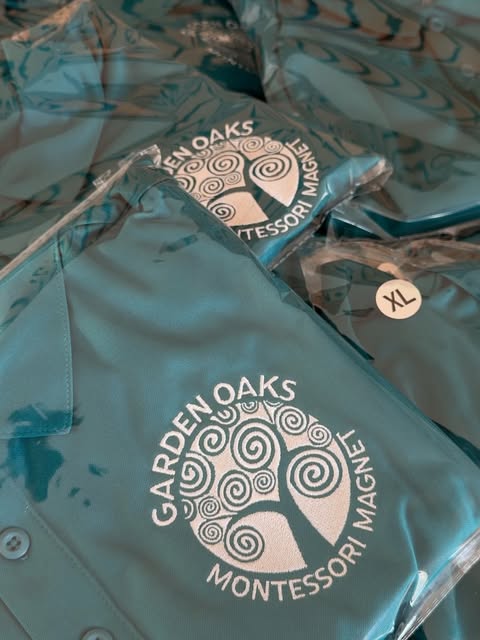 Teal embroidered polos with Garden Oaks Montessori Magnet logo